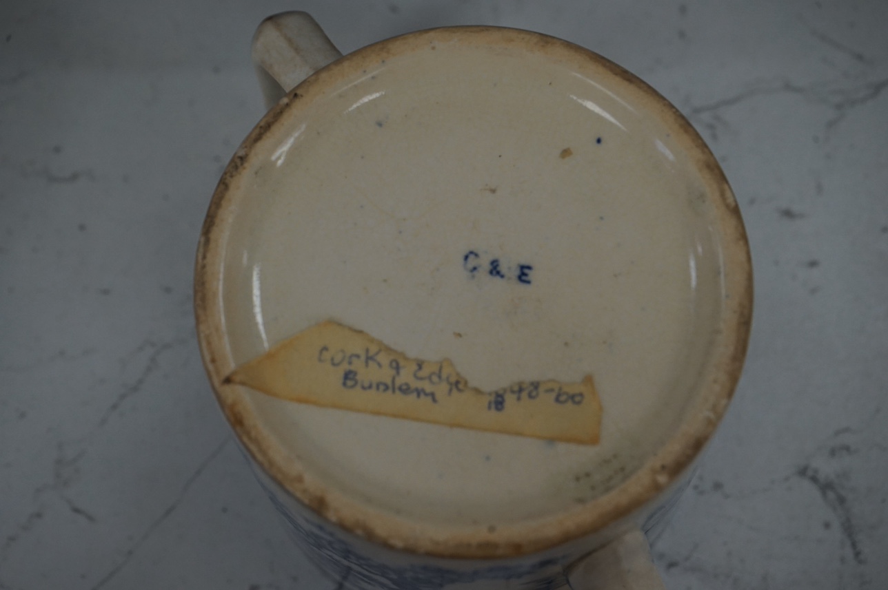 A group of blue and white ceramics to include Ironstone cheese dome and jug, a basin and twin handled cups, largest 36cm in diameter. Condition - varies